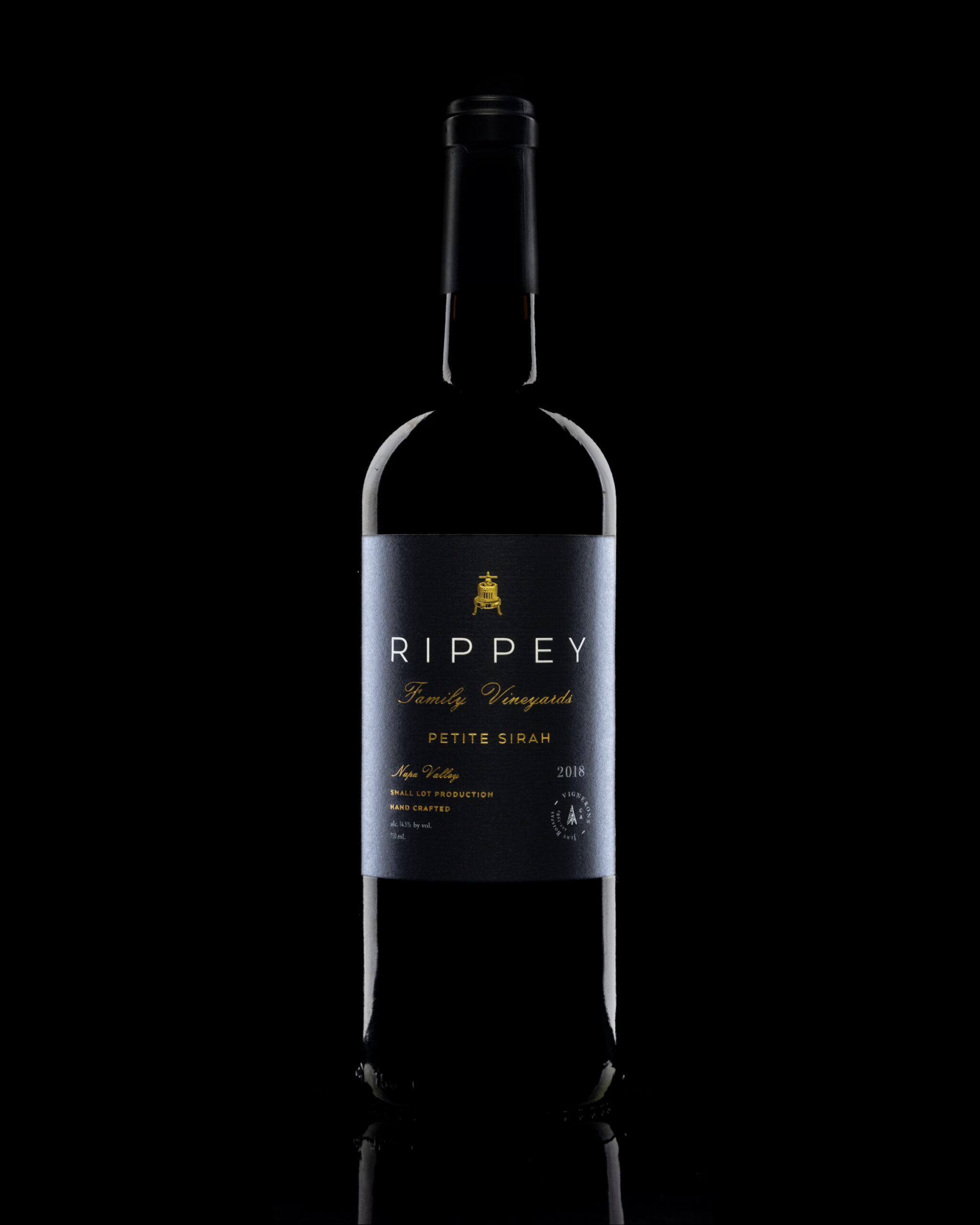 Product photography by Drew Cornick of a bottle of Rippey Petite Sirah (Syrah)